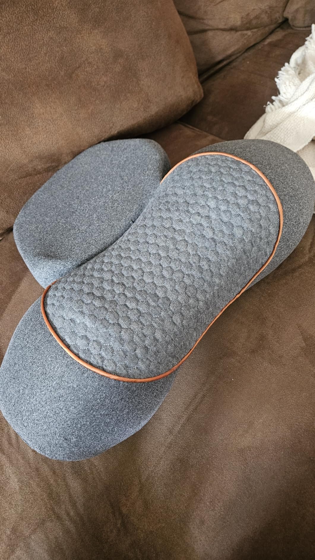 Customer photo - SpineSway Quad Fusion Neck Massager on sofa